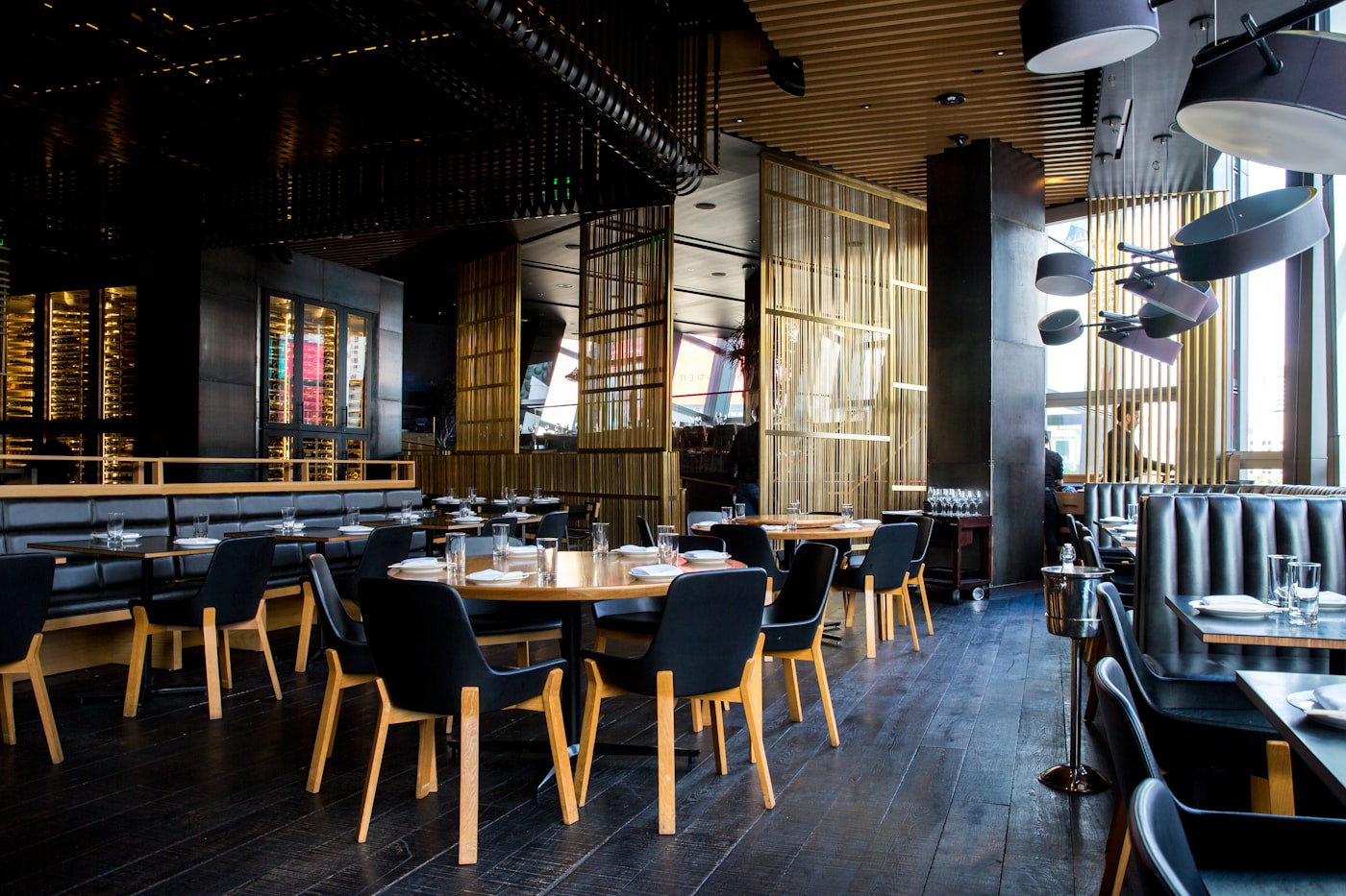 Warm restaurant seating with wooden tables